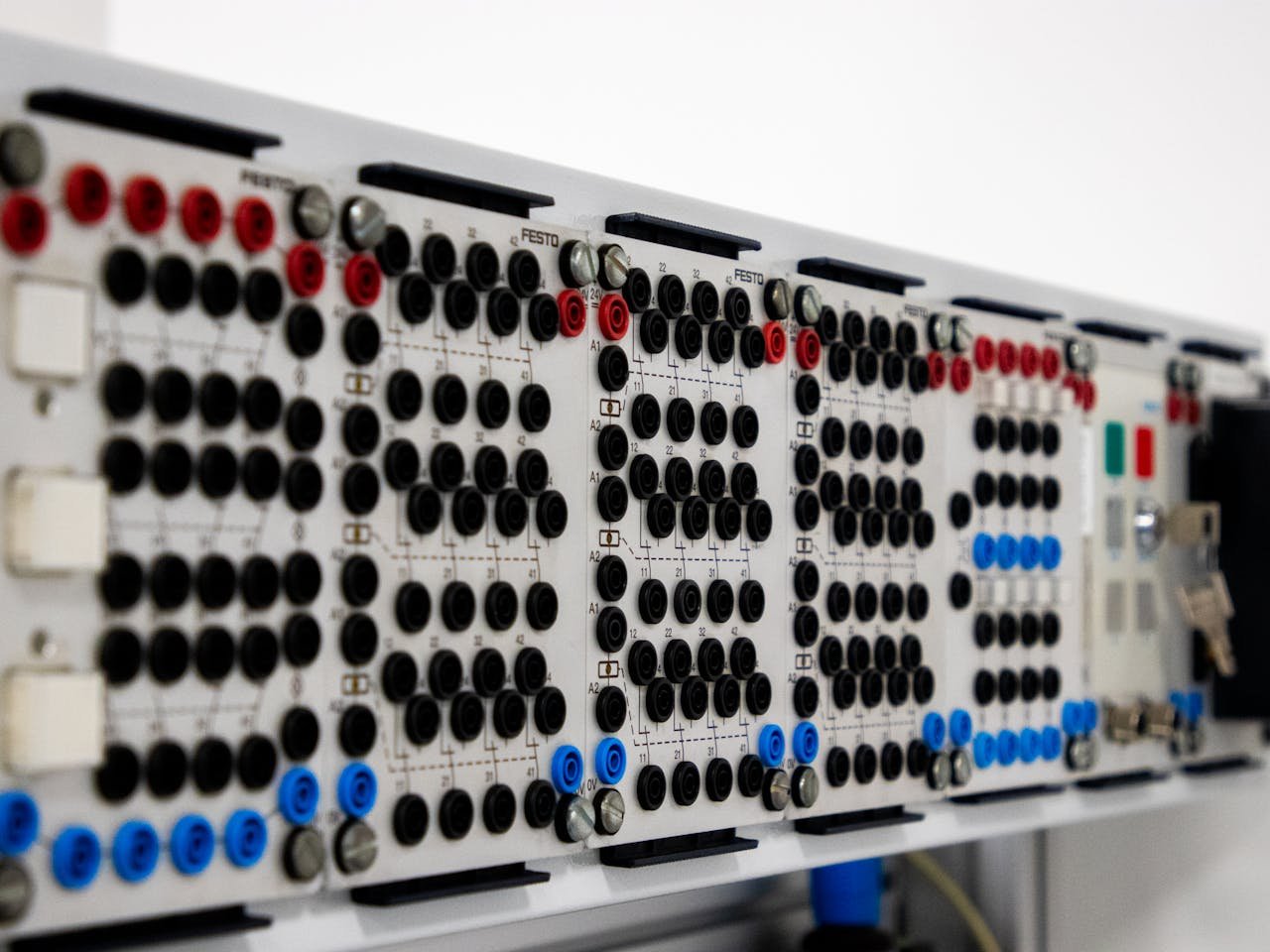 Detailed image of a modern industrial control panel featuring multiple connectors and buttons.